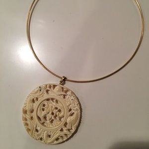 Exquisite ivory pendant on gold wire necklace